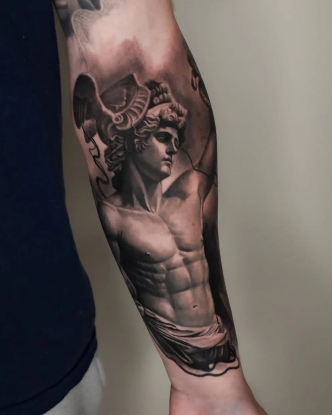 black and grey arm tattoo