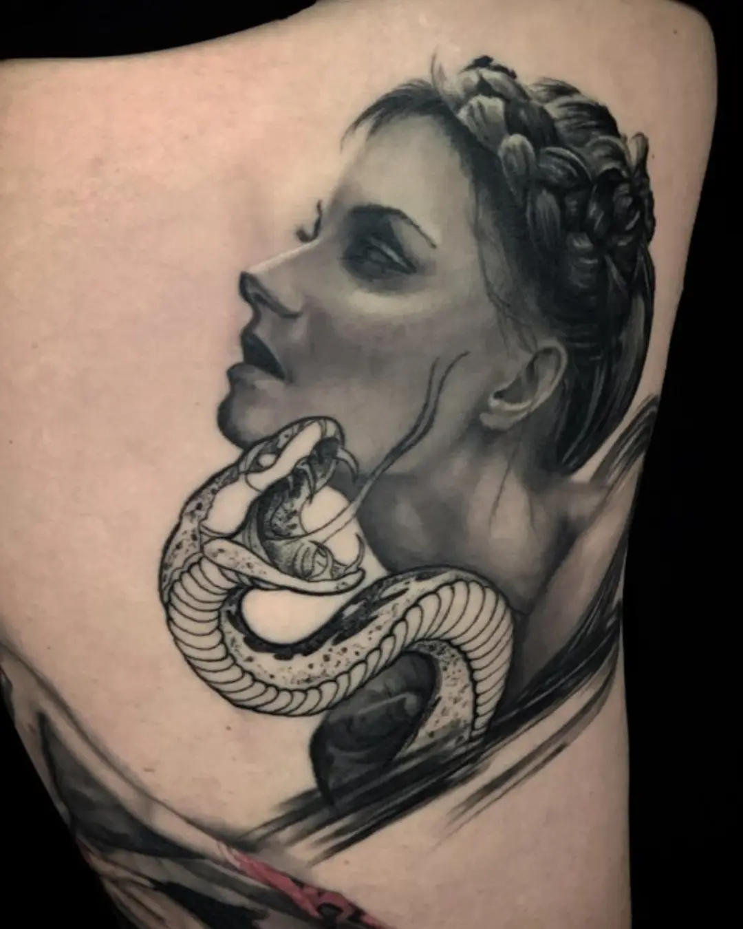 black and grey back tattoo