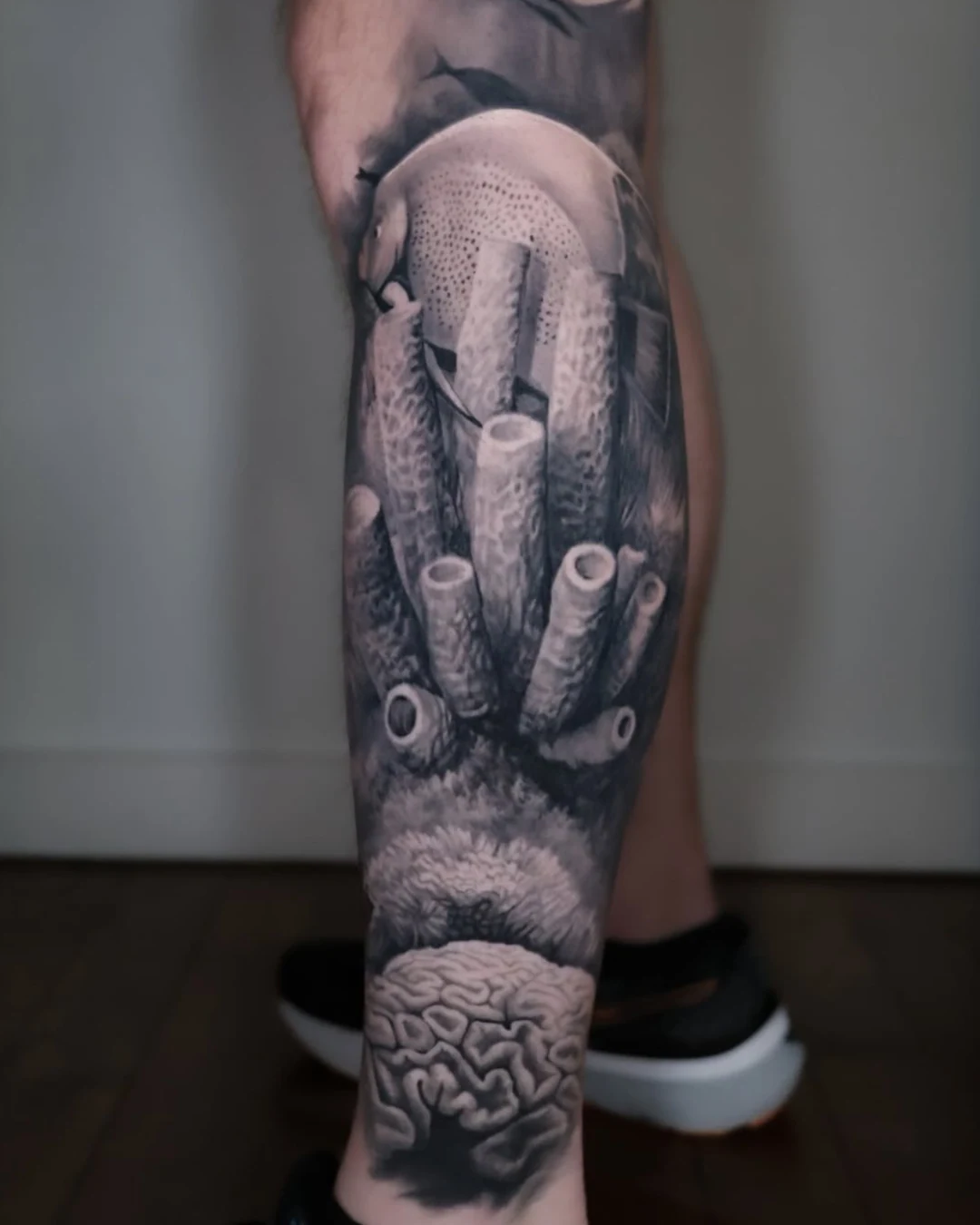 Black and grey fine line tattoo