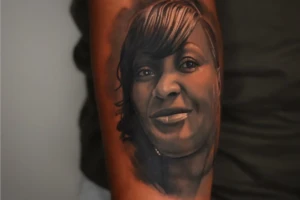 what is a black and grey portrait tattoo design