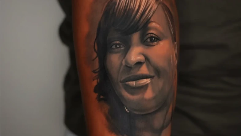 what is a black and grey portrait tattoo design