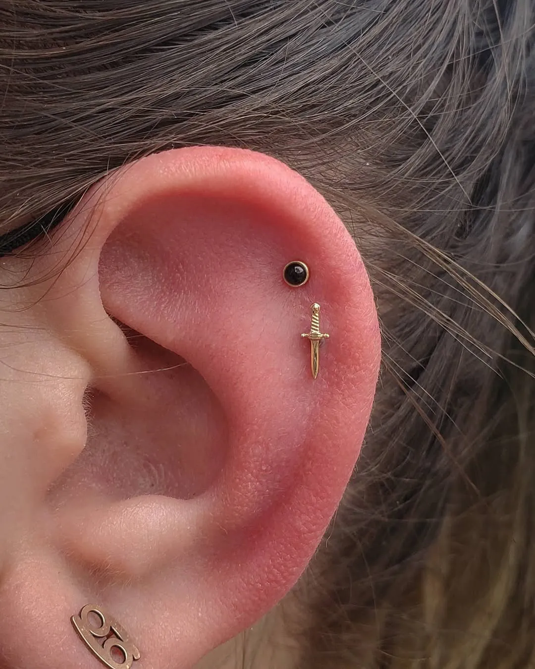 madeline kelso double helix piercing dagger and gemstone