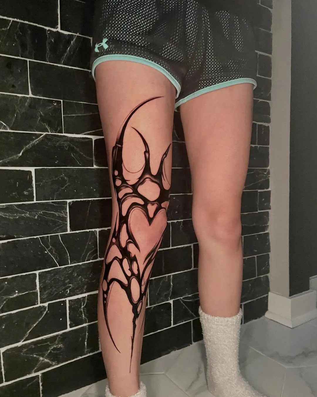 molly kelso abstract biomechanical blackwork tattoo