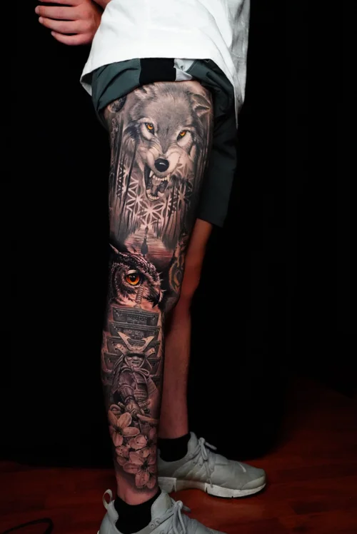 Nelson-Aviles-black-and-grey-surreal-tattoo-with-Renaissance-style-gods-and-orange-accents