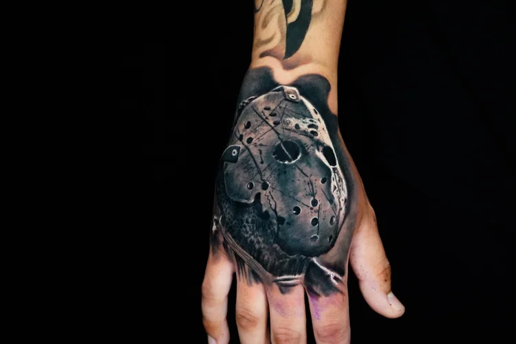 Nelson-Aviles-black-and-grey-tattoo-sleeve-with-tribal-mask-and-mechanical-elements
