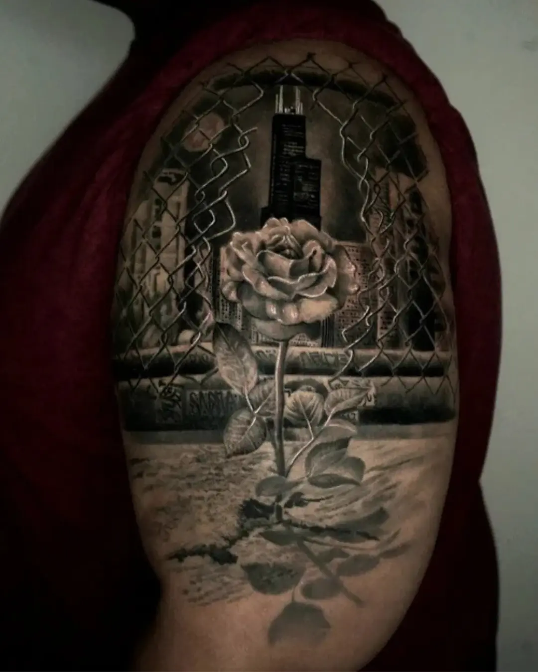 Surrealism-tattoo-of-a-blooming-rose-beneath-a-city-skyline-combining-beauty-and-urban-decay