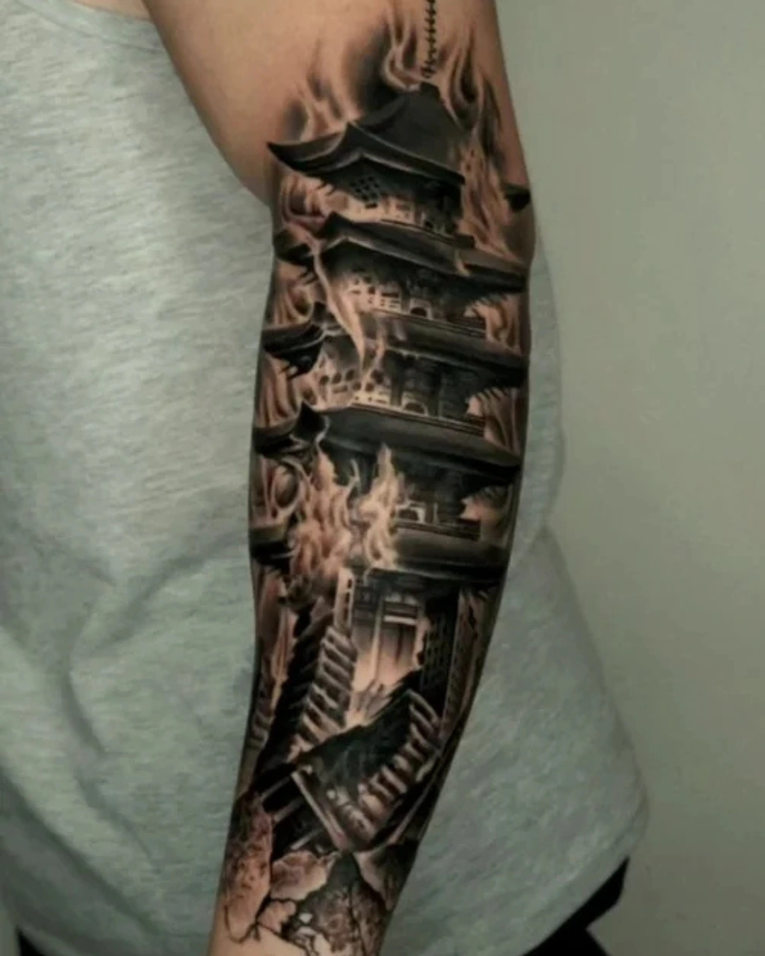 Surrealism tattoo of fragmented architecture and temples consumed by fire symbolizing spiritual collapse