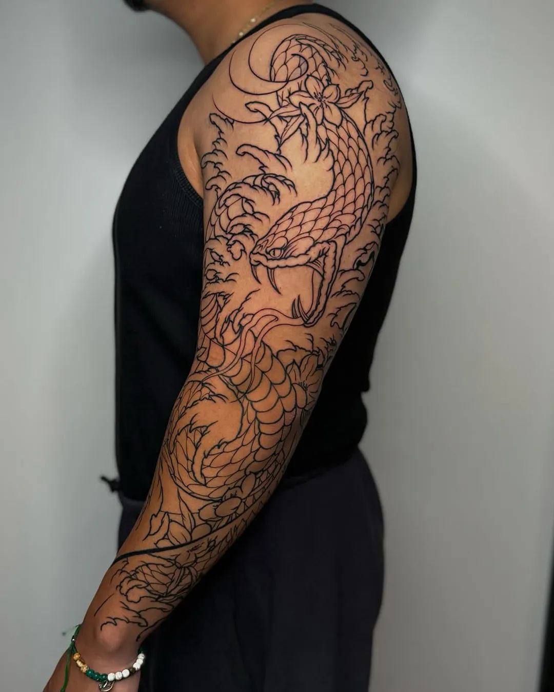 sofiia tattoo artist chicago sleeve tattoo dragon flowers
